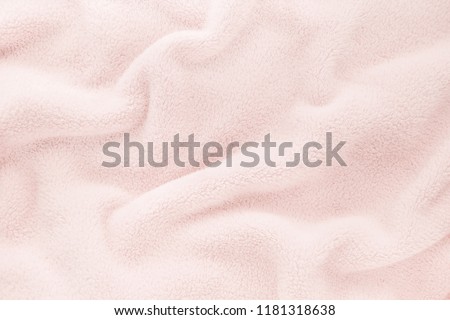 Fluffy Gentle baby pastel pink rose fabric with waves and folds. Soft pastel textile texture. Folds on the soft fabric. Rose towel terry cloth.