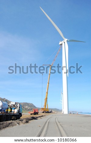 wind turbine and crane under maintenance
