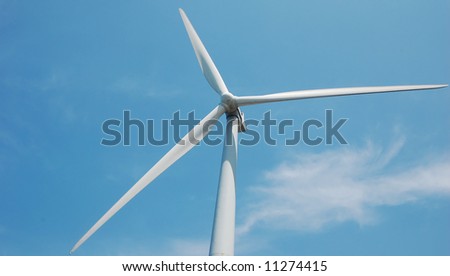 wind turbine with one blade in the horizontal position, read to produce power