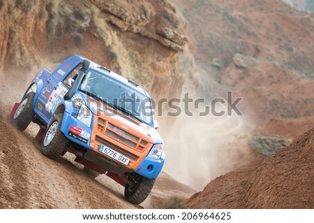 TERUEL, ARAGON/SPAIN - JULY 18: Spanish Driver, Luciano Cueva tries to get a good result in Prologue in Baja Aragon Rally on July 18, 2014 in Teruel