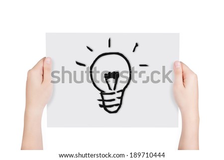 Woman hands holding paper with free hand drawing bulb isolated on white background. Include clipping path.