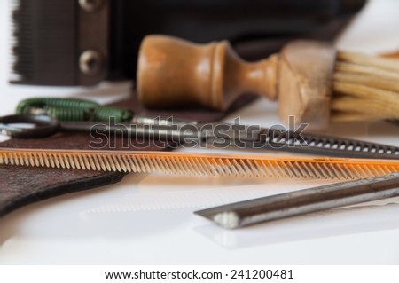 Scissors, barber's brush and comb is basic equipment of hair