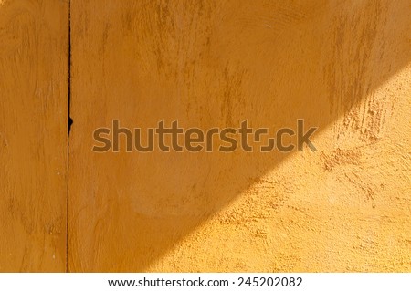 Abstract wall, yellow concrete wall with shadow