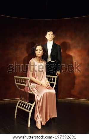 BANGKOK, THAILAND - FEB. 02, 2014: Wax figures of The Royal Family of Thailand are only in Bangkok at museum Madame Tussauds, Feb. 2, 2014. Prince Mahidol Adulyadej and Mom Sangwan in their engagement