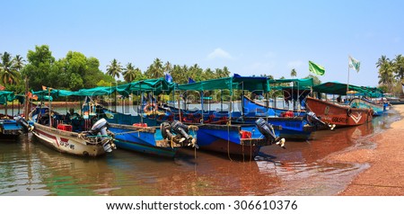 CANDOLIM, GOA, INDIA - 11 APR 2015: Sinquerim-Candolim Boat Owners Association in Goa, India. Wooden boats are on the jetty.