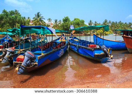 CANDOLIM, GOA, INDIA - 11 APR 2015: Sinquerim-Candolim Boat Owners Association in Goa, India. Wooden boats are in the harbor.