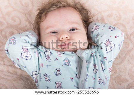 The baby wants to sleep.Beautiful baby.The child in the crib.baby on the bed.Portrait of a smiling child.