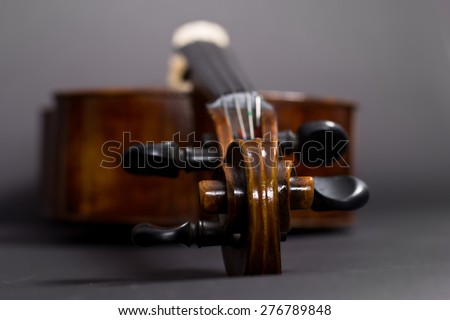 Old Violoncello on a black background. Musical instrument. Stringed musical instrument. cello