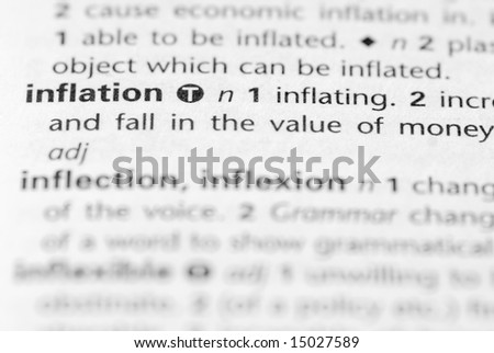 Inflation - Word in book isolated by shallow depth of field