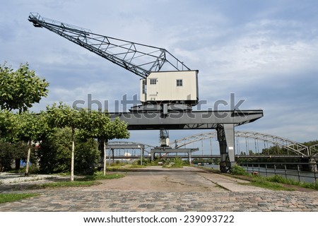 two old harbor cranes in frankfurt east end