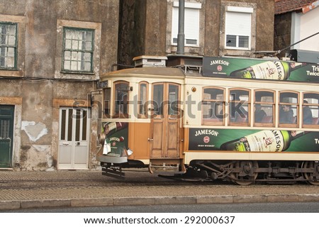 PORTO, PORTUGAL - FEBRUARY 20, 2014: Old tram in the center of Porto, Portugal. Tourist attraction