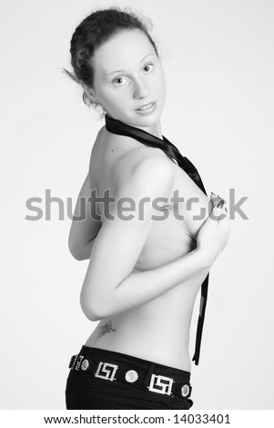 stock photo A naked young girl is in a black tie covers hands a