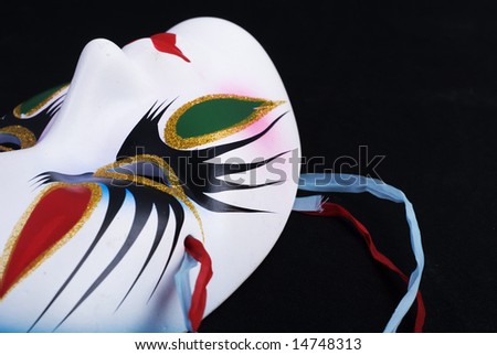 Color carnival beauty mask at black background
