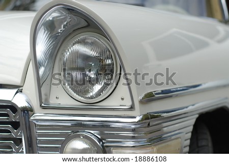 headlight of a white luxury retro limousine