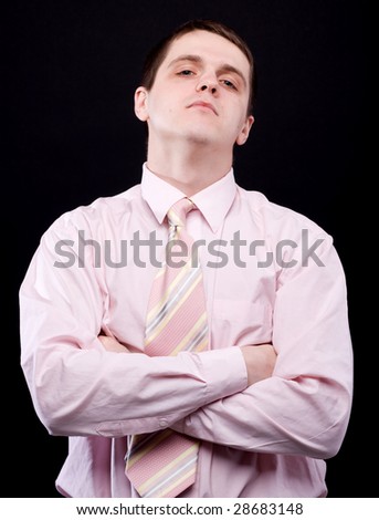 Young man in pink shirt with necktie