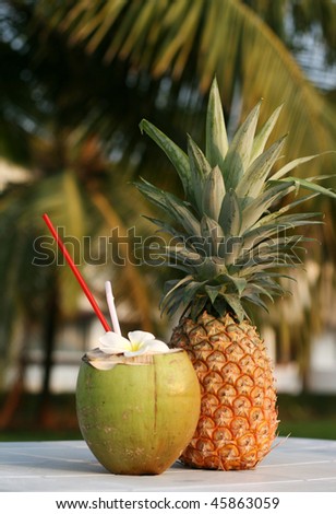 fresh coconut drink and pineapple on the table
