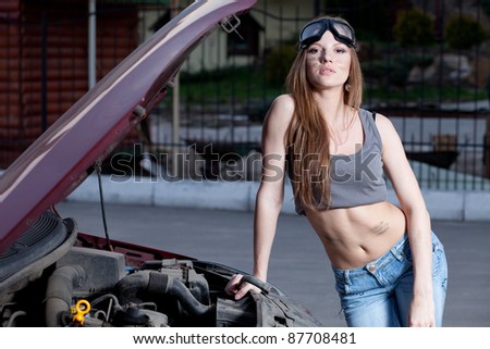 Nice woman mechanic repair broken red car