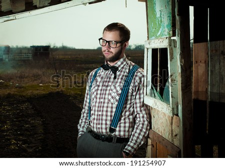 Redneck nerd man in glasses with beard outdoor