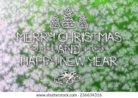 Merry Christmas and New Year hand drawing greeting card with blurred frozen snowflakes on green colored winter background