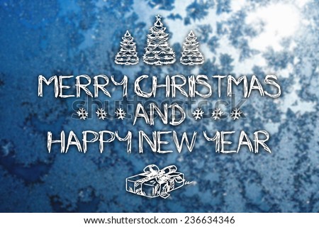 Merry Christmas and New Year hand drawing greeting card on blurred winter blue colored background