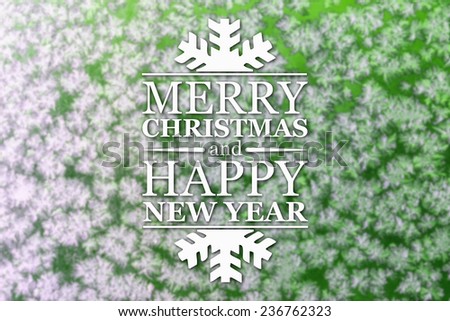 Merry Christmas and New Year greeting card with blurred frozen snowflakes on green colored winter background