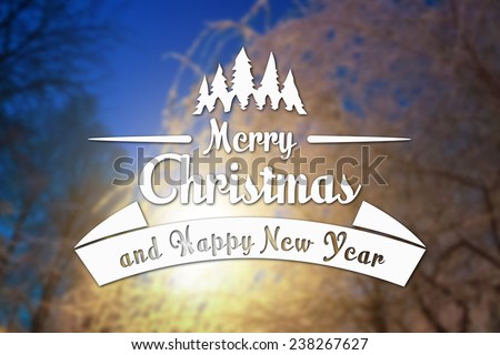 Merry Christmas and New Year greeting card on blurred tree branches with frost and light blue sky background