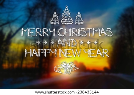 Merry Christmas and New Year hand drawing greeting card on blurred winter road and glowing sun at sunset background
