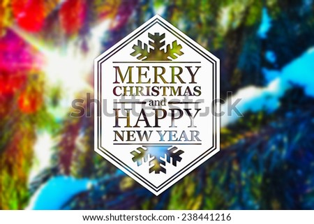 Merry Christmas and New Year greeting card on blurred spruce or fir-tree branches with snow and sun light background
