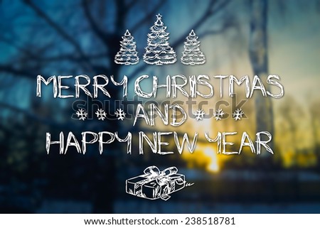Merry Christmas and New Year hand drawing greeting card on blurred tree and icicle at sunset blue colored background