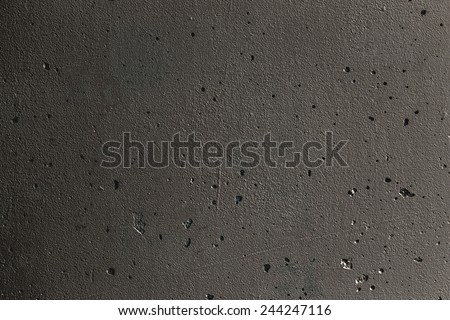 Grunge plaster cement or concrete wall texture dark gray color