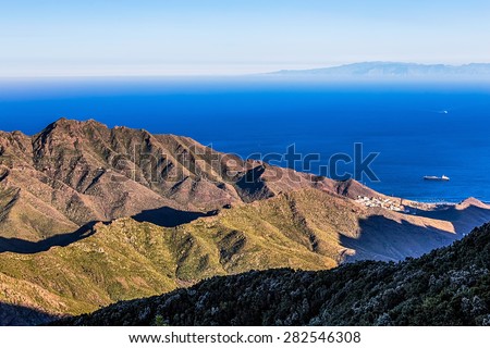 View to ocean or sea with ship from above from rock or mountain with island on background
