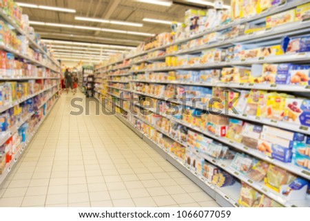 Blurred scene of alley shelf colorful grocery supermarket aisle