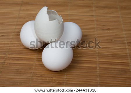White and brown eggs, and  abroken white egg