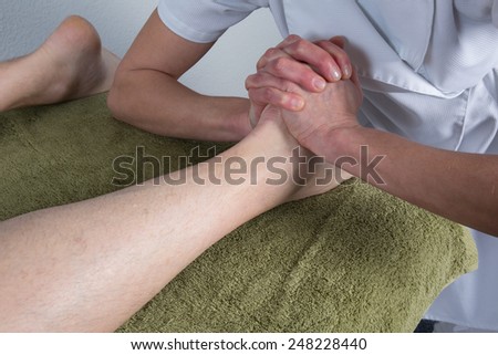 Chinese massage on man\'s feet
