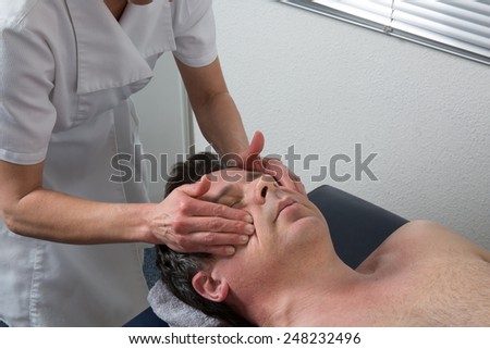 A man having a chinese massage on table massage