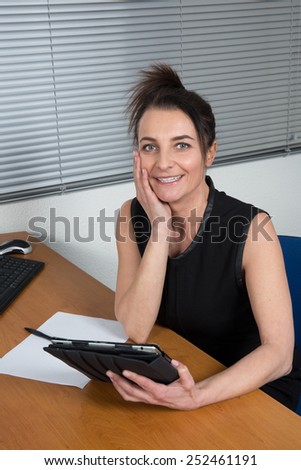 Businesswoman working in the office, waiting or a call