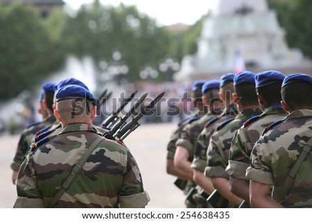 A french armed marching soldier