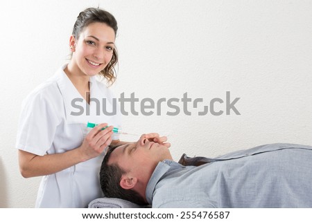Man gets an injection in his face