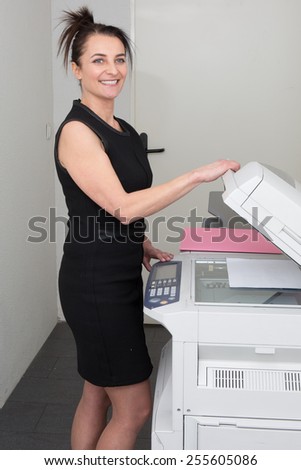 secretary using a copy machine