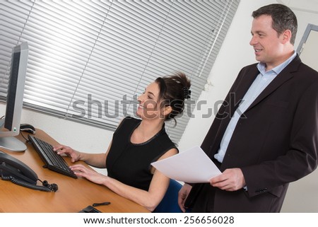Manager and his secretary working in the office