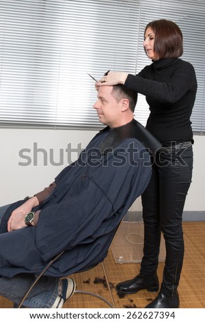 Close up shot of man getting his hair cut