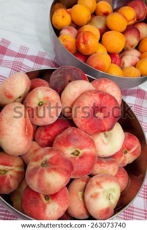 Juicy peaches and apricots  in a basket isolated