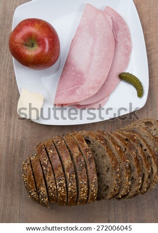 Brown slices of bread with ham and apple , for diet lunch