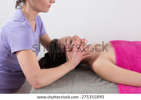 Woman chinese therapist is doing a chinese massage