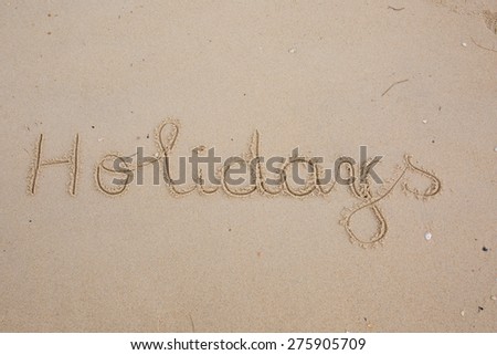 The inscription on the sand - holidays, vacation paradise.