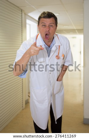 Doctor afraid at hospital waiting for patient