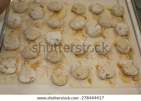Closeup of baker preparing bread dough at commercial bakery