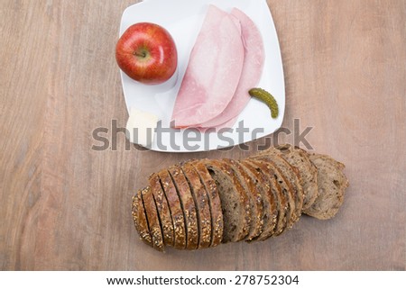 Brown slices of bread with ham and apple , for diet lunch