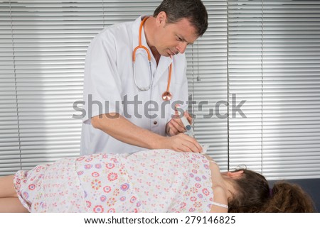 Male  doctor giving vaccination girl, health, prevention