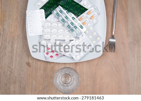 A Pills on a plate as food supplement